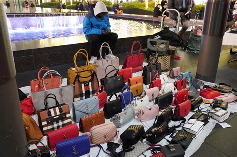 selling fake clothes|selling counterfeit handbags.